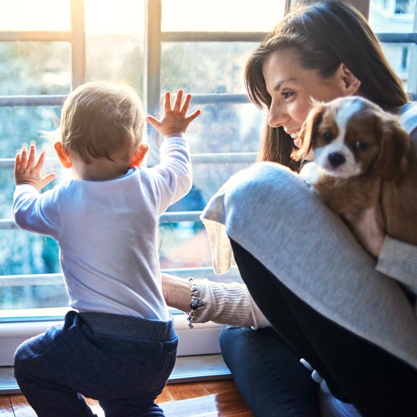 mother with dog and young son