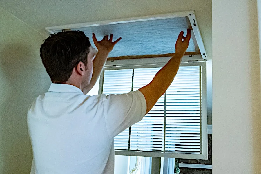 cypress air technician replaces air duct filter