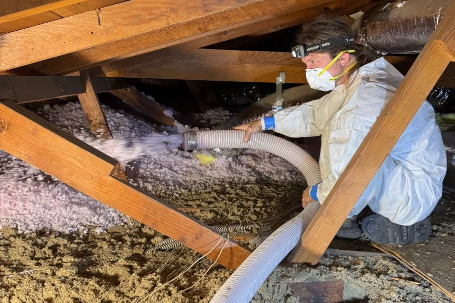 cypress air technician blowing insulation in attic
